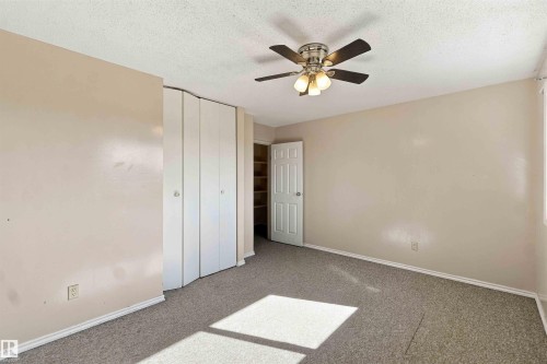 Neutral tone walls with integrated ceiling fan and light fixture - 17351 85 Avenue Nw, Edmonton, AB 