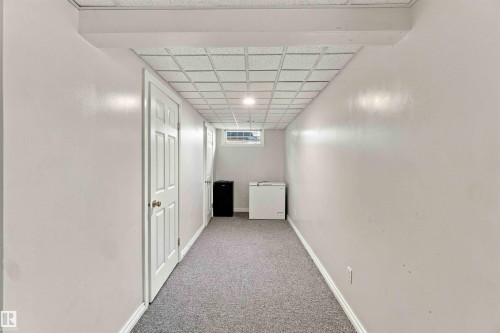 Recessed lighting, drop ceiling, window, light gray carpet, and white trim - 17351 85 Avenue Nw, Edmonton, AB 