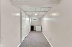 Recessed lighting, drop ceiling, window, light gray carpet, and white trim - 