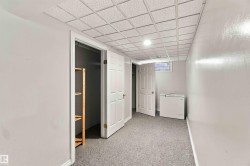 Recessed ceiling lighting, drop ceiling, window, built-in shelving, carpet flooring - 