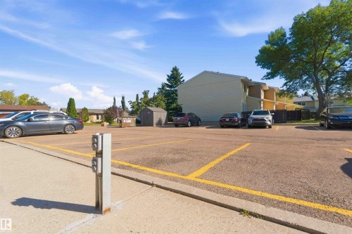 Paved parking lot with designated spaces and an exterior power pedestal - 17351 85 Avenue Nw, Edmonton, AB 