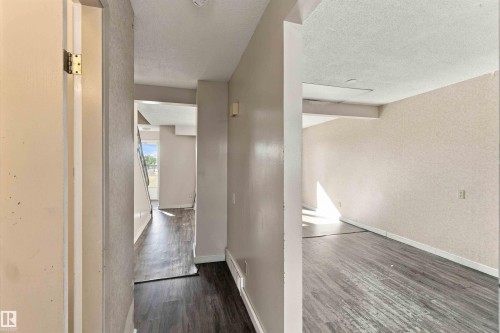 Wood-finish flooring throughout, with light-toned walls - 17351 85 Avenue Nw, Edmonton, AB 