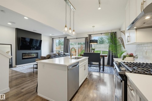 22434 99A Avenue Nw, Edmonton, AB - Indoor Photo Showing Kitchen With Fireplace
