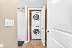 Stackable washer and dryer within a dedicated utility closet - 