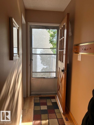 Hardwood-finish flooring, solid wood interior door, and a built-in coat rack - 29 Lindbergh Crescent, St. Albert, AB 