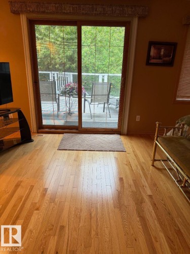 Hardwood flooring, sliding glass door, and outdoor decking - 29 Lindbergh Crescent, St. Albert, AB 