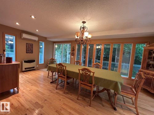 Hardwood flooring, recessed ceiling lighting, a chandelier, and expansive windows - 29 Lindbergh Crescent, St. Albert, AB 