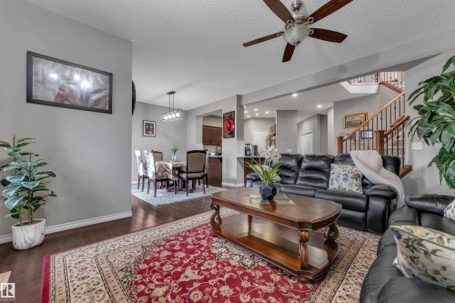 Hardwood-finish flooring throughout, recessed lighting, and a ceiling fan with integrated lighting - 3230 21A Avenue Nw, Edmonton, AB 