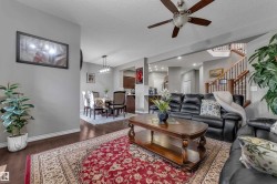 Hardwood-finish flooring throughout, recessed lighting, and a ceiling fan with integrated lighting - 