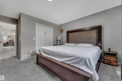 Carpeted flooring, neutral wall paint, and white bi-fold closet doors - 