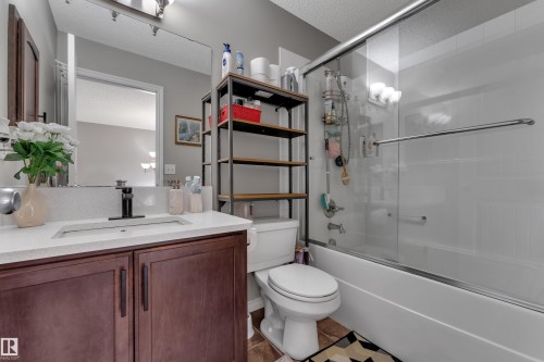 White solid surface countertop with an integrated rectangular sink - 3230 21A Avenue Nw, Edmonton, AB 