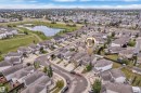Residential subdivision featuring detached homes with grey shingle roofs - 3230 21A Avenue Nw, Edmonton, AB 