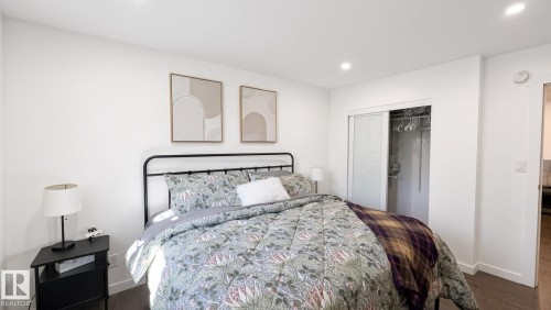 Recessed lighting, wood-finish flooring, and a closet with sliding doors - 3508 106A Street Nw, Edmonton, AB 