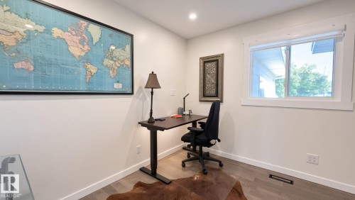 Recessed lighting, wood-finish flooring, and a large window with white trim - 3508 106A Street Nw, Edmonton, AB 