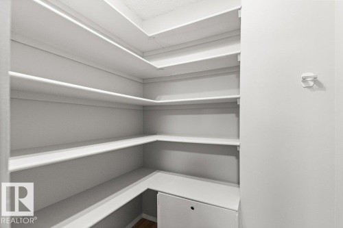 Built-in shelving, white finish, wood-finish flooring - #4 14620 26 St Nw, Edmonton, AB 