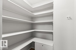 Built-in shelving, white finish, wood-finish flooring - 