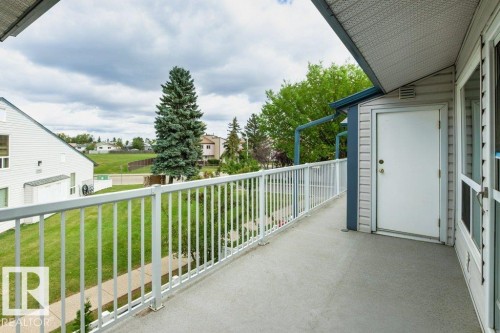 Private balcony with white railing and expansive outdoor space - #4 14620 26 St Nw, Edmonton, AB 