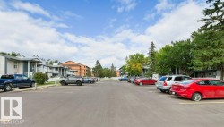 Paved parking lot with designated parking spaces - 