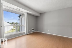 Neutral gray walls complement the wood-finish flooring - 