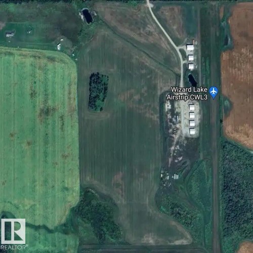 Aerial Survey. Displaying the property and surrounding land features, including an airstrip and agricultural areas - 26453 Twp Rd 481, Rural Leduc County, AB 