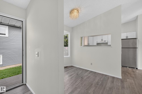 Wood-finish flooring throughout the main areas - 3722 34A Avenue Nw, Edmonton, AB 