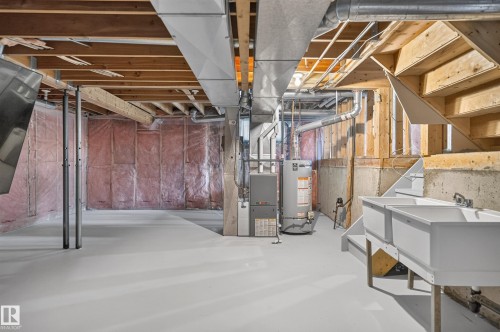 Unfinished basement with exposed wood joists, ductwork, and insulation - 3722 34A Avenue Nw, Edmonton, AB 
