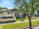 Wood-sided bungalow with a dark shingle roof - 11841 71 Street Nw, Edmonton, AB 