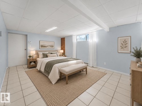 Light blue walls with white trim, tile flooring, drop ceiling with integrated lighting, and a window with sheer white curtains - 11841 71 Street Nw, Edmonton, AB 