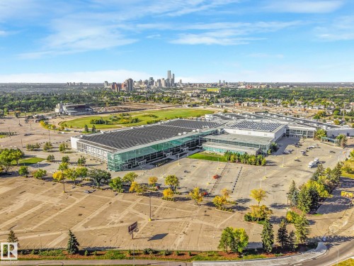Expansive commercial property featuring multiple large structures, extensive paved parking areas, and mature perimeter landscaping - 11841 71 Street Nw, Edmonton, AB 