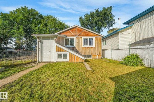 Wood-paneled exterior with multiple windows - 11841 71 Street Nw, Edmonton, AB 