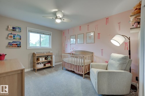 #100 22549 Twp Rd 510, Rural Leduc County, AB - Indoor Photo Showing Bedroom