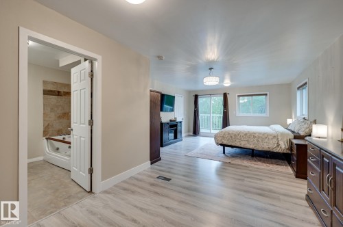 #100 22549 Twp Rd 510, Rural Leduc County, AB - Indoor Photo Showing Bedroom