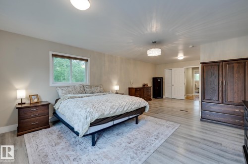 #100 22549 Twp Rd 510, Rural Leduc County, AB - Indoor Photo Showing Bedroom