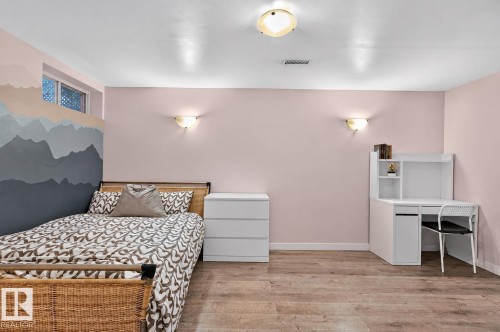 Wood-finish flooring, recessed lighting, and wall sconces - 17919 78 Avenue Nw, Edmonton, AB 