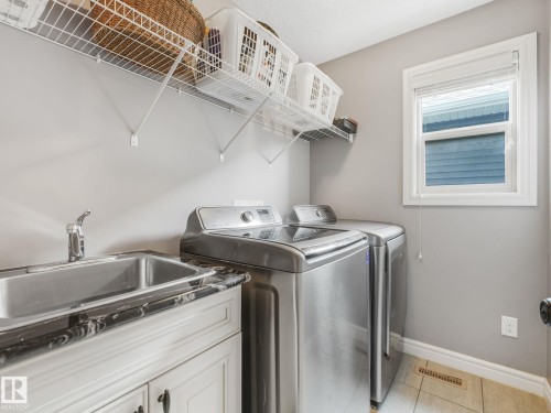 Upstairs, you’ll appreciate the convenience of a dedicated laundry room, complete with a laundry sink — making laundry days effortless and keeping everything perfectly organized. - 3711 Westcliff Way Sw, Edmonton, AB 