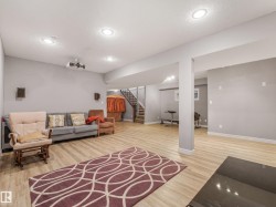 The fully finished basement offers incredible versatility with a massive flex space perfect for a home theater, gym, or recreation room, plus a completed large bedroom and a full bathroom. - 