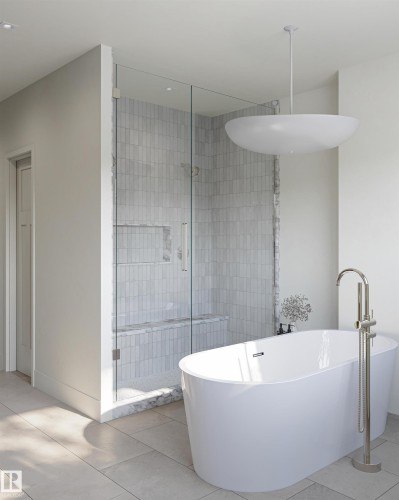 Freestanding soaking tub with floor-mounted faucet - 4117 Ginsberg Place Nw, Edmonton, AB - Indoor Photo Showing Bathroom