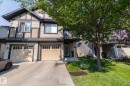Concrete driveway leading to an attached two-car garage - 1640 Chapman Way Sw, Edmonton, AB 