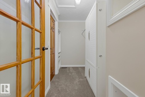 Wood-framed French doors with frosted glass panels - 10621 Beaumaris Road Nw, Edmonton, AB 