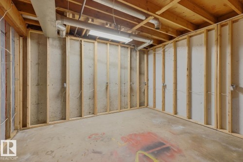 Unfinished basement with concrete flooring and wood wall framing - 10621 Beaumaris Road Nw, Edmonton, AB 