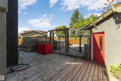 Wooden deck with dark brick exterior wall - 11208 163A Avenue Nw, Edmonton, AB 