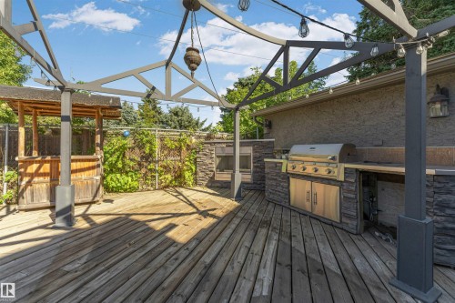 Expansive wood deck with a metal pergola - 11208 163A Avenue Nw, Edmonton, AB 