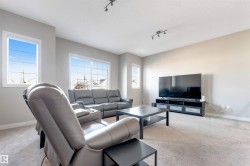 Neutral-toned walls complement the light-colored carpeting - 