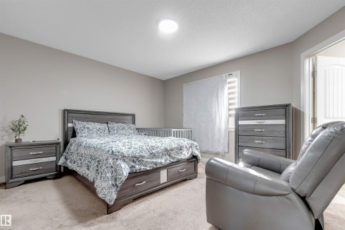 Recessed lighting, neutral wall paint, and a textured ceiling - 136 55 Street Sw, Edmonton, AB 