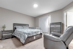 Recessed lighting, neutral wall paint, and a textured ceiling - 