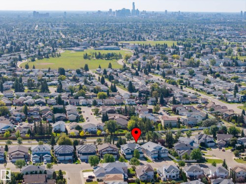 Expansive residential area with mature trees and a distant cityscape - 8513 156 Avenue Nw, Edmonton, AB 