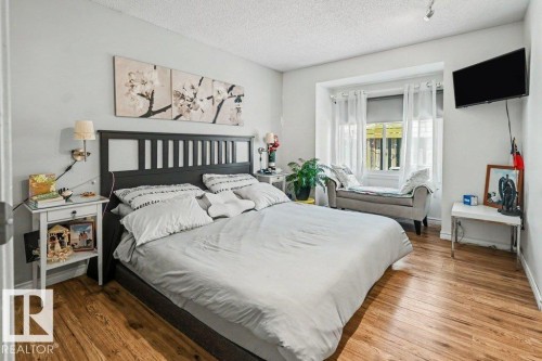 Wood-finish flooring throughout - 8708 25A Avenue Nw, Edmonton, AB 