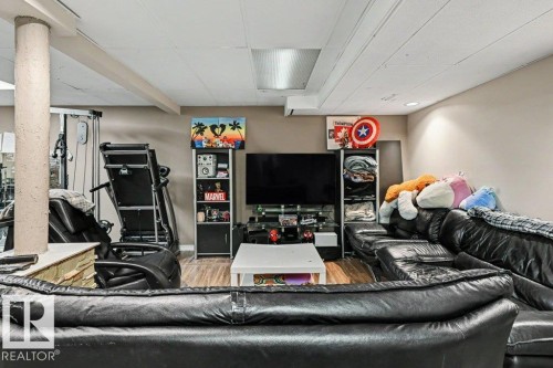 Wood-finish flooring with a neutral wall palette - 8708 25A Avenue Nw, Edmonton, AB 