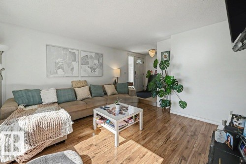 Wood-finish flooring throughout - 8708 25A Avenue Nw, Edmonton, AB 