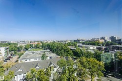 Expansive urban landscape with extensive greenery and residential structures - 